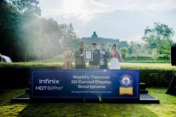 A picture of a group of people holding a plaque in front of a temple.